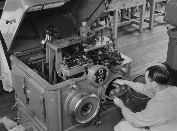 RECORD DATE NOT STATED London School of Printing,Stanford St ,Elephant an London School of Printing,Stanford St ,Elephant and Castle.Photo composing line projector, operator inserting a film cassette into projector which operating from mono-keyboard ribbon exposes letter by letter onto film. (09.06.1955) Retrocon London Views.  Copyright: xShepherdx