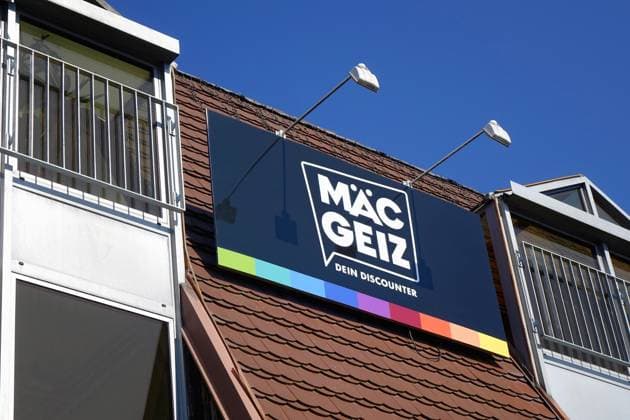 Firmenlogo von Mäc-Geiz Firmenlogo von Mäc-Geiz, 20.05.2025, Werder, Brandenburg, Der Non-Food-Discounter Mäc-Geiz unterhält eine Filiale in Werder.
