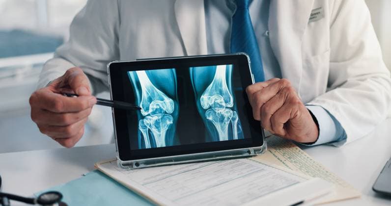 Hands, screen and tablet for x ray with knee, scan or osteoporosis with point at hospital. Doctor, application and ux for medical consultation for arthritis, feedback or report for wellness at clinic Hands, screen and tablet for x ray with knee, scan or osteoporosis with point at hospital. Doctor, application and ux for medical consultation for arthritis, feedback or report for wellness at clinic., model released, , property released, , 97604214.jpg RECORD DATE NOT STATED