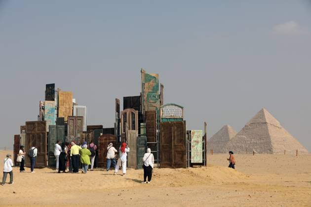 Giza Pyramids, a backdrop for Forever Is Now contemporary art exhibition in EgyptGiza Pyramids, a backdrop for Forever Is Now contemporary art exhibition in Egypt A view of the art installation Doors of Cairo by artist Alexandre Farto from Portugal during the fifth edition of the Forever is Now art exhibition by Art d’Egypte at the Giza pyramids necropolis, Egypt on November 11, 2025. Art D’Égypte, this global art exhibition is a one-of-a-kind event that bridges the brilliance of contemporary art with the grandeur of Egypt’s ancient heritage, showcasing how art interacts with time and place at one of the world’s most iconic heritage sites. This year’s fifth edition features a diverse group of international ten artists from different  Copyright: xMatrixxImagesx xKhaledxElfiqix