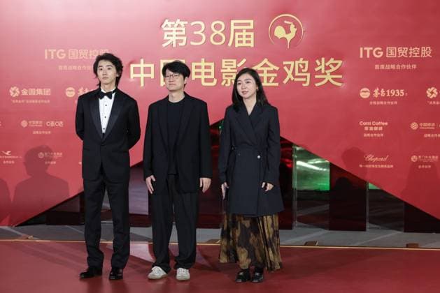 XIAMEN, CHINA - NOVEMBER 15: (L-R) Actor Sun Ning, director Qiu Sheng and producer Li Lingyan of My Father s Son arrive at the red carpet for the closing ceremony during the 38th China Golden Rooster Awards on November 15, 2025 in Xiamen, Fujian Province of China.  Copyright: xVCGx 111604072464