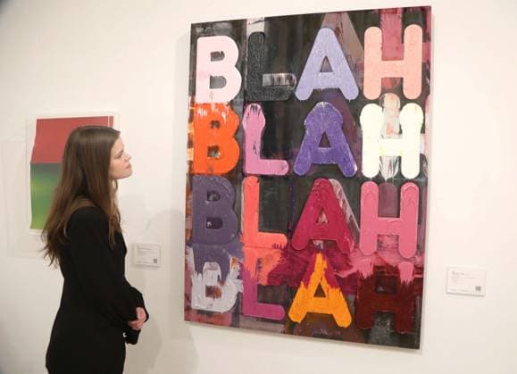 November 18, 2025, New York, New York, USA: A woman looks at ‘Blah, Blah, Blahâ€⠢ by artist Mel Bochner, 2013, estimate $60,000 - $80,000, seen on display at the press preview for Marquee Week Fall 2025 Modern and Comtempory Art held at Phillips Auction House New York. New York USA - ZUMAk03_ 20251118_zaf_k03_103 Copyright: xNancyxKaszermanx