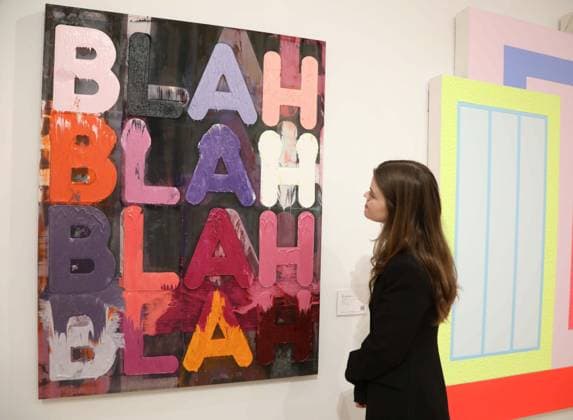 November 18, 2025, New York, New York, USA: A woman looks at ‘Blah, Blah, Blahâ€⠢ by artist Mel Bochner, 2013, estimate $60,000 - $80,000, seen on display at the press preview for Marquee Week Fall 2025 Modern and Comtempory Art held at Phillips Auction House New York. New York USA - ZUMAk03_ 20251118_zaf_k03_101 Copyright: xNancyxKaszermanx
