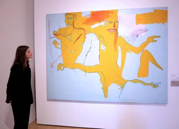 November 18, 2025, New York, New York, USA: A woman looks at Ã¢â‚¬ËœExerciseÃ¢â‚¬â ¢ by artist Jean-Michel Basquiat, 1984, estimate $3 million - $4 million, seen on display at the press preview for Marquee Week Fall 2025 Modern and Comtempory Art held at Phillips Auction House New York. New York USA - ZUMAk03_ 20251118_zaf_k03_087 Copyright: xNancyxKaszermanx