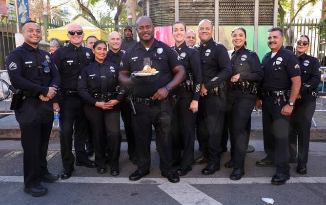 26 November 2025 - Los Angeles, California - Officer Deon Joseph,. 2025 Thanks & Giving On Skid Row held at Los Angeles Mission. Photo Copyright: xAdMediax