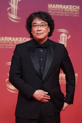 Jury President Bong Joon ho arrives on stage during the Opening Ceremony during the 22nd Marrakech International Film Festival on November 28, 2025 in Marrakech, Morocco Marrakech, Morocco 28 11 2025 451096 2025 11 28 MARRAKECH Morocco  Copyright: xRomualdxMeigneuxx xStarfacex STAR_451096_032