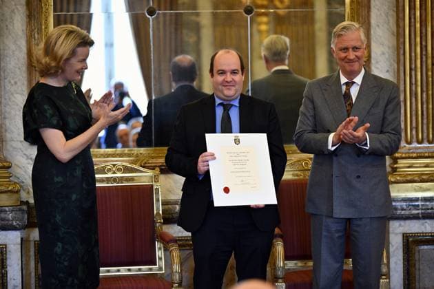 Queen Mathilde of Belgium, Jannes Jacobs of Options Belgium and King Philippe - Filip of Belgium pose for the photographer during a royal reception with the newly appointed suppliers holding a Royal warrant of appointment (Brevet van Hofleverancier - Brevet de Fournisseurs de la cour), at the Royal Palace, in Brussels, Wednesday 03 December 2025.  ERICxLALMAND 146116907