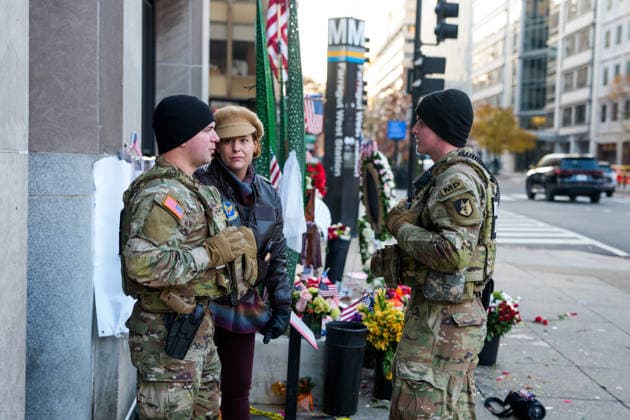 Members of the National Guard patrol near the location of a shooting that killed one National Guard member and left another in critical condition last month outside the Farragut West Metro Station in Washington DC on Sunday, December 7, 2025. A 29-year-old suspect pled not guilty to murder and assault charges earlier this week.  WAP2025120725005 AARONxSCHWARTZ