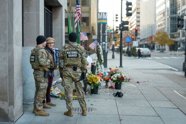 Members of the National Guard patrol near the location of a shooting that killed one National Guard member and left another in critical condition last month outside the Farragut West Metro Station in Washington DC on Sunday, December 7, 2025. A 29-year-old suspect pled not guilty to murder and assault charges earlier this week.  WAP2025120725008 AARONxSCHWARTZ