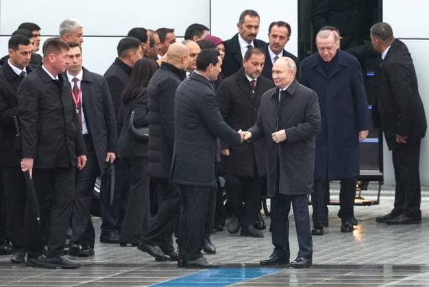 Turkmenistan Russia 9069861 12.12.2025 Russian President Vladimir Putin is welcomed by Turkmen President Serdar Berdimuhamedov alongside Turkish President Recep Tayyip Erdogan before a wreath-laying ceremony at the Turkmenistan Neutrality Monument in Ashgabat, Turkmenistan. Alexander Shcherbak Sputnik Ashgabat Turkmenistan  Copyright: xAlexanderxShcherbakx