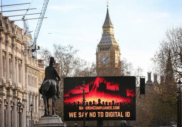 December 13, 2025, London, United Kingdom: A large screen says We Say No To Digital ID in front of the Elizabeth Tower in Whitehall. The Mass Non Compliance group are protesting against the Labour Government s plan to introduce digital identity cards, claiming that it would increase the government s surveillance powers while threatening individual privacy and freedom. London United Kingdom - ZUMAs197 20251213_aaa_s197_437 Copyright: xMartinxPopex