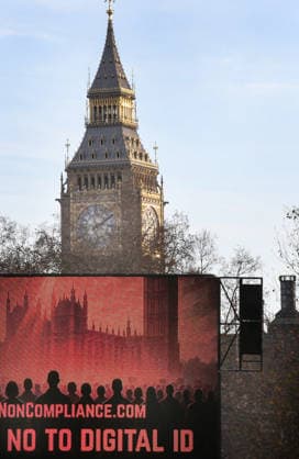 December 13, 2025, London, United Kingdom: A large screen says No To Digital ID in front of the Elizabeth Tower in Whitehall. The Mass Non Compliance group are protesting against the Labour Government s plan to introduce digital identity cards, claiming that it would increase the government s surveillance powers while threatening individual privacy and freedom. London United Kingdom - ZUMAs197 20251213_aaa_s197_443 Copyright: xMartinxPopex