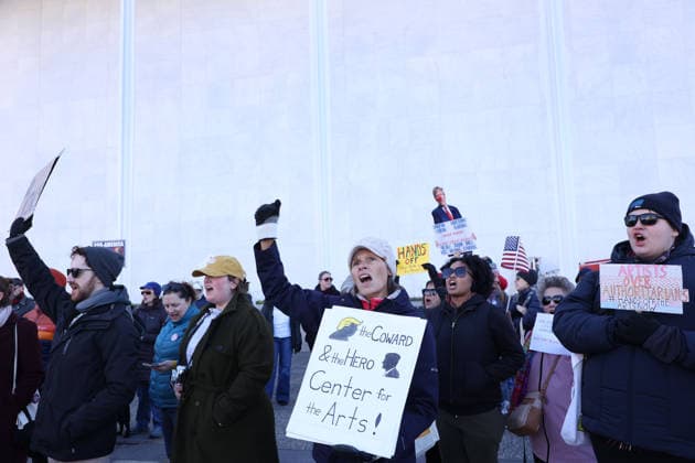 Protest against the name of Donald J. Trump to the Kennedy Center In Washington DC, USA. Demonstrators hold signs as they protest in front of the John F. Kennedy Memorial Center for the Performing Arts building, in Washington, D.C., USA, on December 20, 2025. Activists opposed adding the name Donald J. Trump to the Kennedy Center for the Performing Arts. Washington DC USA  Copyright: xMatrixxImagesx xGentxShkullakux