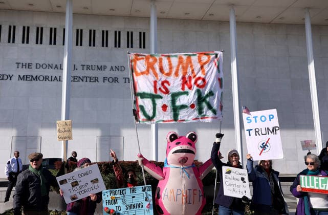 Protest against the name of Donald J. Trump to the Kennedy Center In Washington DC, USA. Demonstrators hold signs as they protest in front of the John F. Kennedy Memorial Center for the Performing Arts building, in Washington, D.C., USA, on December 20, 2025. Activists opposed adding the name Donald J. Trump to the Kennedy Center for the Performing Arts. Washington DC USA  Copyright: xMatrixxImagesx xGentxShkullakux