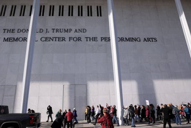 Protest against the name of Donald J. Trump to the Kennedy Center In Washington DC, USA. Demonstrators hold signs as they protest in front of the John F. Kennedy Memorial Center for the Performing Arts building, in Washington, D.C., USA, on December 20, 2025. Activists opposed adding the name Donald J. Trump to the Kennedy Center for the Performing Arts. Washington DC USA  Copyright: xMatrixxImagesx xGentxShkullakux