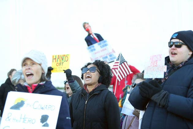 Protest against the name of Donald J. Trump to the Kennedy Center In Washington DC, USA. Demonstrators hold signs as they protest in front of the John F. Kennedy Memorial Center for the Performing Arts building, in Washington, D.C., USA, on December 20, 2025. Activists opposed adding the name Donald J. Trump to the Kennedy Center for the Performing Arts. Washington DC USA  Copyright: xMatrixxImagesx xGentxShkullakux