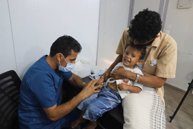 Thousands of children in Yemen have no access to vaccination and health services due to conflicts HAJJAH, YEMEN - FEBRUARY 1: A doctor checks a kid baby as admission to the facility exceeds more than 300 in a day at Jada Health Facility in Maidi district of Hajjah city, Yemen on February 1, 2022. Children of thousands of families who forced to move to safe areas in Hajjah city, were deprived of health services, especially necessary vaccines such as polio, diphtheria, measles and hepatitis B due to ongoing violence and conflict. Yemen has been engulfed by violence and instability since 2014, when Iran-aligned Houthi rebels captured much of the country, including the capital Sanaa. Yemen World. Editorial use only. Please get in touch for any  Copyright: x2025xAnadoluxMohammedxAlxWafix