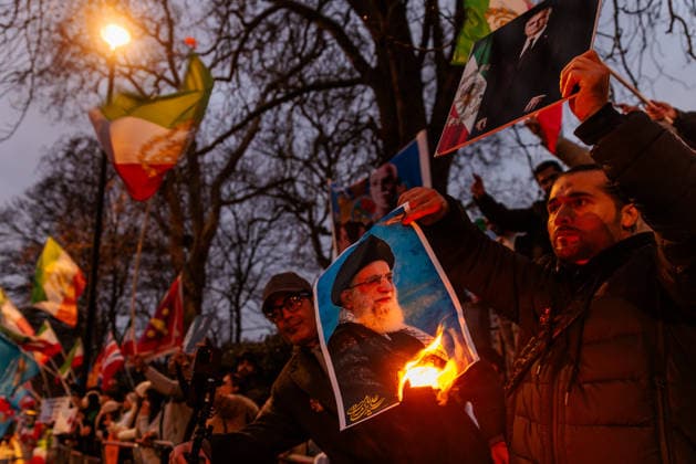 Iran Solidarity Protest, Iranian Embassy, London, UK. Iranian Embassy, London, UK. 12th January 2026. Protester holds a burning image of the Ayatollah, Ali Khamenei in one hand and the exiled Crown Prince of Iran, Reza Pahlavi in the other. Activists and members of the Iranian community in London have been gathering in front of the Iranian Embassy in support of the protests in Iran and against the Islamic Republic and Ayatollah., Credit:Photo by Amanda Rose Avalon United Kingdom, London, Knightsbridge, Embassy of the Islamic Republic of Iran Copyright: xPhotoxbyxAmandaxRosex xAvalonx 1065486382