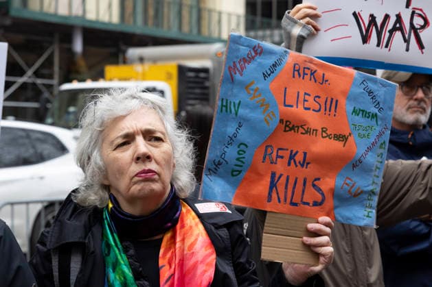March 7, 2026, New York, New York, USA: Scientists, health professionals, students and community advocates attend the Stand Up For Science Rally to Take Back Science at City Hall Park in Lower Manhattan demanding scientific integrity, strong public health protections, and democratic accountability. A person holds a sign that reads RFK Jr. LIES!!! BATSHIT BOBBY RFK JR. KILLS MEASLES ALUMINUM LYME HIV COVID Mifepristone FLUORIDE AUTISM TESTOSTERONE ACETAMINOPHEN FLU HEPATITIS B. Protesters denounce the Trump administration s massive cuts to government research funding and grants, the downsizing of federal science agency staff, the overhaul of the nationâ€⠢s public health policies under U.S. Secretary of Health and Human Services R. F. - ZUMAr174 20260307_znp_r174_011 Copyright: xGinaxMxRandazzox