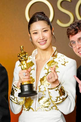 EJAE, Mark Sonnenblick, Joong Gyu Kwak, Yu Han Lee, Hee Dong Nam, Jeong Hoon Seo, and Teddy Park celebrate in the press photo room after winning the Best Original Song Oscar for Golden from KPop Demon Hunters during the 98th annual Academy Awards in the Hollywood section of Los Angeles on Sunday, March 15, 2026.  LAP20260315396 BONNIExCASH