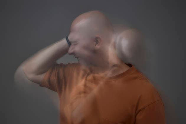 Mature person struggling with anxiety in studio with motion blur model released, Symbolfoto, KPEF01329