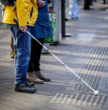 THE HAGUE - Occasionally, narrow white ribbed lines with relief tiles and tiles with small hemispheres (studs) can be seen in the streetscape. These are tactile guidance lines that serve as a very useful mobility aid for the blind and visually impaired. With these, a person with a visual impairment, with or without a white cane, receives a message: the direction of travel, a warning, or an important landmark. ROBIN UTRECHT ANP netherlands out - belgium out  Copyright: xx x554801677x originalFilename: 554801677.jpg