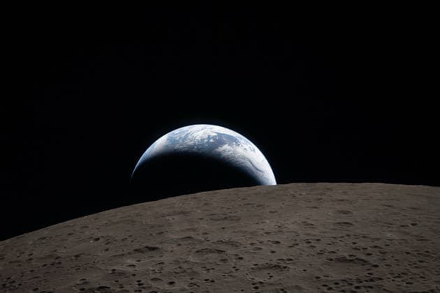 April 7, 2026, Orion Capsule, Outer Space: Earthset, where the blue Earth with bright white clouds sets behind the cratered lunar surface is captured through the Orion spacecraft window at 6:41 p.m. EDT, April 6, 2026, during the Artemis II crewâ€⠢s flyby of the Moon. The dark portion of Earth is experiencing nighttime. On Earthâ€⠢s day side, swirling clouds are visible over the Australia and Oceania region... ..In the foreground, Ohm crater has terraced edges and a flat floor interrupted by central peaks. Central peaks form in complex craters when the lunar surface, liquefied on impact, splashes upwards during the craterâ€⠢s formation. Credit: NASA Orion Capsule Outer Space - ZUMAp138 20260407_zaa_p138_008 Copyright: xNasa Nasax