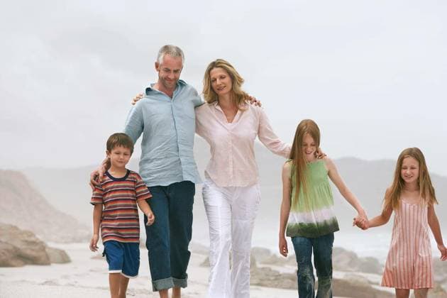 Happy Caucasian Family On Beach - Happy Caucasian couple walking with children at beach model released Symbolfoto Copyright: xmoodboardx Panthermedia75390178.jpg