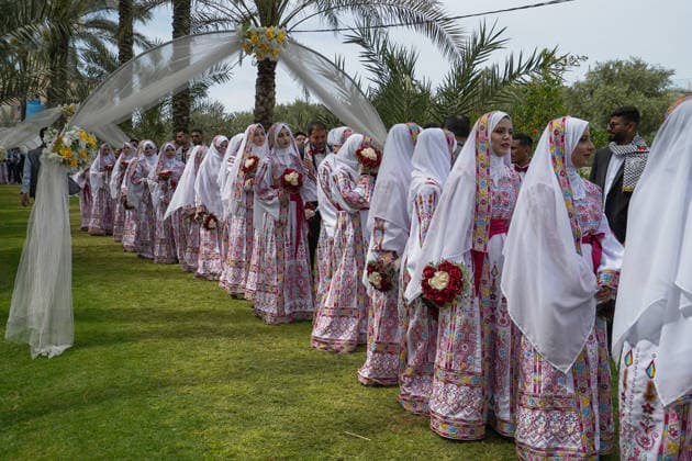 150 couples got married in a mass wedding ceremony in Deir al-Balah DEIR AL-BALAH, GAZA, PALESTINE - APRIL 24: Couples are seen in line as mass wedding ceremony organized by the United Arab Emirates under the ‘Al-Fares Al-Shahem’ initiative where 150 Palestinian couples got married in Deir al-Balah, Gaza, Palestine, on April 24, 2026. Adam Bilal Anadolu Deir al-Balah Gaza. Editorial use only. Please get in touch for any other usage.  Copyright: x2026xAnadoluxAdamxBilalx