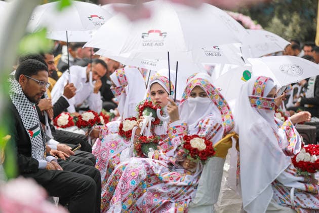150 couples got married in a mass wedding ceremony in Deir al-Balah DEIR AL-BALAH, GAZA, PALESTINE - APRIL 24: Couples are seen as mass wedding ceremony organized by the United Arab Emirates under the ‘Al-Fares Al-Shahem’ initiative where 150 Palestinian couples got married in Deir al-Balah, Gaza, Palestine, on April 24, 2026. Adam Bilal Anadolu Deir al-Balah Gaza. Editorial use only. Please get in touch for any other usage.  Copyright: x2026xAnadoluxAdamxBilalx