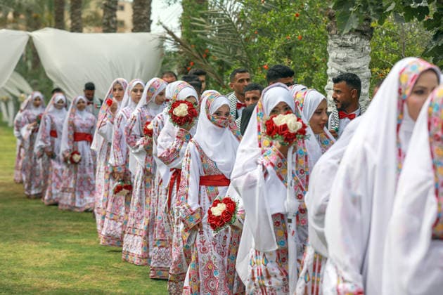 150 couples got married in a mass wedding ceremony in Deir al-Balah DEIR AL-BALAH, GAZA, PALESTINE - APRIL 24: Couples are seen as mass wedding ceremony organized by the United Arab Emirates under the ‘Al-Fares Al-Shahem’ initiative where 150 Palestinian couples got married in Deir al-Balah, Gaza, Palestine, on April 24, 2026. Adam Bilal Anadolu Deir al-Balah Gaza. Editorial use only. Please get in touch for any other usage.  Copyright: x2026xAnadoluxAdamxBilalx