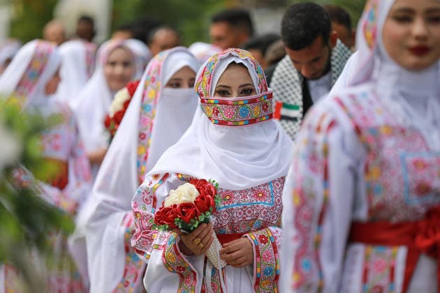150 couples got married in a mass wedding ceremony in Deir al-Balah DEIR AL-BALAH, GAZA, PALESTINE - APRIL 24: Couples are seen as mass wedding ceremony organized by the United Arab Emirates under the ‘Al-Fares Al-Shahem’ initiative where 150 Palestinian couples got married in Deir al-Balah, Gaza, Palestine, on April 24, 2026. Adam Bilal Anadolu Deir al-Balah Gaza. Editorial use only. Please get in touch for any other usage.  Copyright: x2026xAnadoluxAdamxBilalx