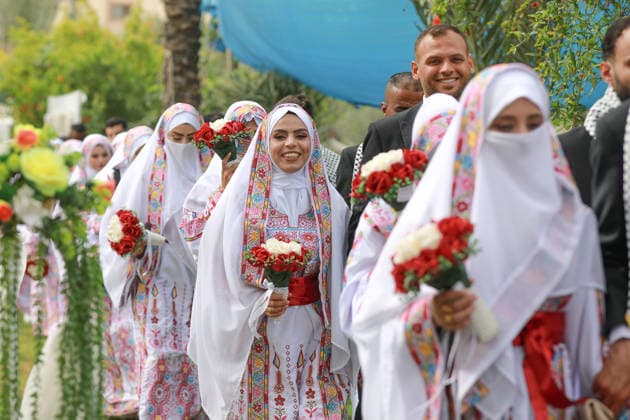 150 couples got married in a mass wedding ceremony in Deir al-Balah DEIR AL-BALAH, GAZA, PALESTINE - APRIL 24: Couples are seen as mass wedding ceremony organized by the United Arab Emirates under the ‘Al-Fares Al-Shahem’ initiative where 150 Palestinian couples got married in Deir al-Balah, Gaza, Palestine, on April 24, 2026. Adam Bilal Anadolu Deir al-Balah Gaza. Editorial use only. Please get in touch for any other usage.  Copyright: x2026xAnadoluxAdamxBilalx