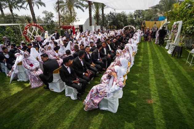 150 couples got married in a mass wedding ceremony in Deir al-Balah DEIR AL-BALAH, GAZA, PALESTINE - APRIL 24: Couples are seen as mass wedding ceremony organized by the United Arab Emirates under the ‘Al-Fares Al-Shahem’ initiative where 150 Palestinian couples got married in Deir al-Balah, Gaza, Palestine, on April 24, 2026. Adam Bilal Anadolu Deir al-Balah Gaza. Editorial use only. Please get in touch for any other usage.  Copyright: x2026xAnadoluxAdamxBilalx