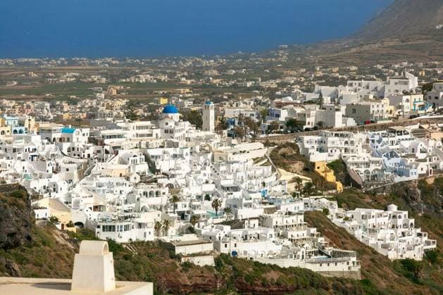 Elevated panoramic view of white buildings in Imerovigli village on the island of Santorini, Greece Copyright: xkavalenkavax Panthermedia100656150.jpg