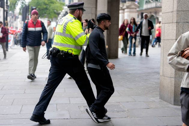 . 04 05 2026. London, United Kingdom. London May Day March. Police detain two men at the annual London May Day March from Clerkenwell Green to Trafalgar Square.where a rally is held.  xMartynxWheatleyx xi-Imagesx IIM-26745-0008