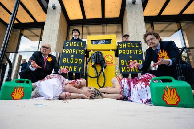 Climate Activists Pour Fake Blood over Protesters at Mock Petrol Pump outside Shell Centre, London, UK 6 May 2026 Activists lie on the ground in front of a mock petrol pump reading Oil Profit$$$ for Oil Bo$$es as they are doused in red liquid resembling blood outside the Shell Centre, London, UK, on 6 May 2026, during a Fossil Free London protest targeting Shell ahead of an expected jump in quarterly profits amid the US-Iran conflict., Credit:Pete Speller Avalon London, United Kingdom  Copyright: xPetexSpellerx xAvalonx 1096871565