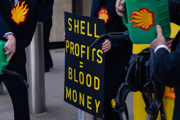 Climate Activists Pour Fake Blood over Protesters at Mock Petrol Pump outside Shell Centre, London, UK 6 May 2026 Activists lie on the ground in front of a mock petrol pump reading Oil Profit$$$ for Oil Bo$$es as they are doused in red liquid resembling blood outside the Shell Centre, London, UK, on 6 May 2026, during a Fossil Free London protest targeting Shell ahead of an expected jump in quarterly profits amid the US-Iran conflict., Credit:Pete Speller Avalon London, United Kingdom  Copyright: xPetexSpellerx xAvalonx 1096871591
