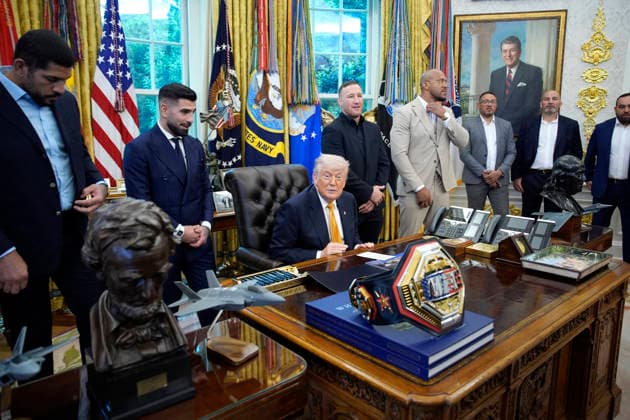 President Donald Trump, flanked by group of UFC fighters, speaks in the Oval Office of the White House in Washington, DC on Wednesday, May 6, 2026.  WASP20260506128 YurixGripas