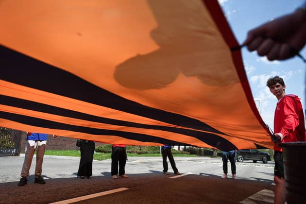 RUSSIA, MOSCOW - MAY 7, 2026: People unfurl a giant St George ribbon during an event titled You Cannot Cancel Truth and Memory! outside the German Embassy in Moscow. Sofya Sandurskaya TASS  92136525