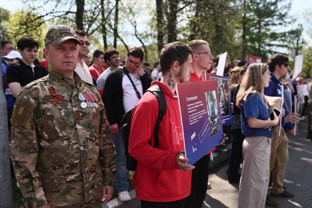 RUSSIA, MOSCOW - MAY 7, 2026: People take part in an event titled You Cannot Cancel Truth and Memory! outside the German Embassy in Moscow. Sofya Sandurskaya TASS  92136511