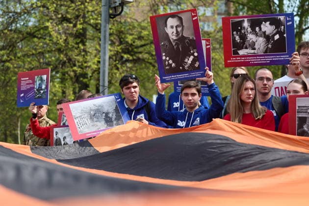 RUSSIA, MOSCOW - MAY 7, 2026: People unfurl a giant St George ribbon during an event titled You Cannot Cancel Truth and Memory! outside the German Embassy in Moscow. Sofya Sandurskaya TASS  92137152