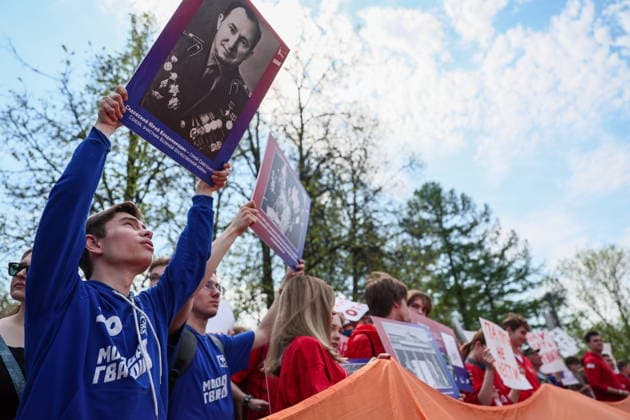RUSSIA, MOSCOW - MAY 7, 2026: People unfurl a giant St George ribbon during an event titled You Cannot Cancel Truth and Memory! outside the German Embassy in Moscow. Sofya Sandurskaya TASS  92137154