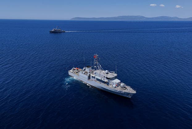 EFES-2026 Exercise in Izmir IZMIR, TURKIYE - MAY 07: An aerial view show Aydin-class mine hunter ship TCG Akcay (M-270) maneuvers in the deep blue sea, creating a large white wake and foam trail during a mine hunting operation as part of the EFES-2026 Exercise in Izmir on May 7, 2026. Conducted by the Turkish Armed Forces (TSK), the tactical exercise involved the detection and successful destruction of maritime mines to ensure safe passage in the region. Berkan Cetin Anadolu Izmir Turkey. Editorial use only. Please get in touch for any other usage.  Copyright: x2026xAnadoluxBerkanxCetinx