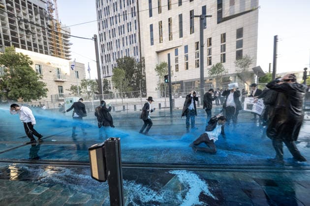 Ultra-Orthodox Jews protest mandatory military service in Jerusalem JERUSALEM - MAY 7: Israeli police use water cannons to disperse Ultra-Orthodox Jewish (Haredi) protesters blocking roads by lying on the ground during a demonstration against the arrest of several yeshiva students over mandatory military service in West Jerusalem on May 7, 2026. Mostafa Alkharouf Anadolu Jerusalem Israel. Editorial use only. Please get in touch for any other usage.  Copyright: x2026xAnadoluxMostafaxAlkharoufx