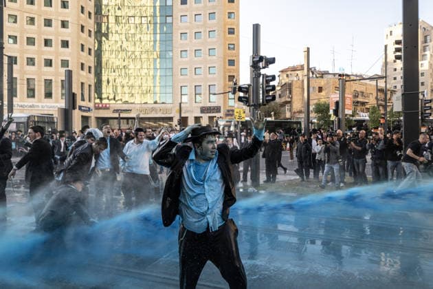 Ultra-Orthodox Jews protest mandatory military service in Jerusalem JERUSALEM - MAY 7: Israeli police use water cannons to disperse Ultra-Orthodox Jewish (Haredi) protesters blocking roads by lying on the ground during a demonstration against the arrest of several yeshiva students over mandatory military service in West Jerusalem on May 7, 2026. Mostafa Alkharouf Anadolu Jerusalem Israel. Editorial use only. Please get in touch for any other usage.  Copyright: x2026xAnadoluxMostafaxAlkharoufx