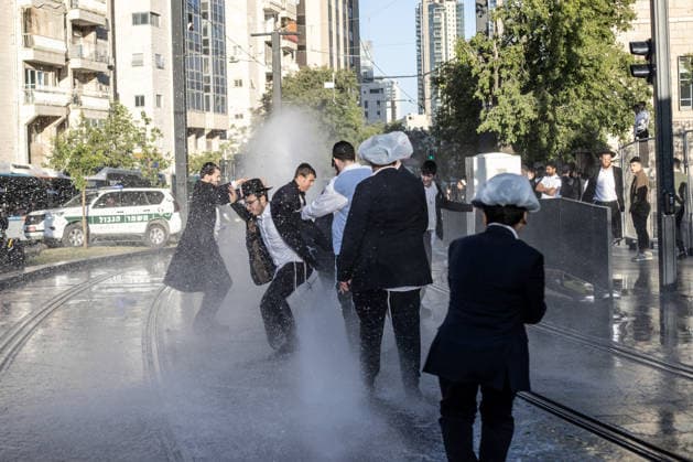 Ultra-Orthodox Jews protest mandatory military service in Jerusalem JERUSALEM - MAY 7: Israeli police use water cannons to disperse Ultra-Orthodox Jewish (Haredi) protesters blocking roads by lying on the ground during a demonstration against the arrest of several yeshiva students over mandatory military service in West Jerusalem on May 7, 2026. Mostafa Alkharouf Anadolu Jerusalem Israel. Editorial use only. Please get in touch for any other usage.  Copyright: x2026xAnadoluxMostafaxAlkharoufx
