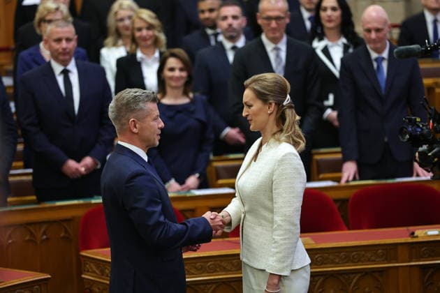 (260509) -- BUDAPEST, May 9, 2026 -- Peter Magyar (L, front), leader of Hungary s Tisza Party, congratulates Agnes Forsthoffer on being elected as speaker of the National Assembly in Budapest, Hungary, May 9, 2026. Hungary s new parliament convened on Saturday for its inaugural session, electing Agnes Forsthoffer, vice president of the Tisza Party, as speaker of the National Assembly. In the parliamentary elections, the Tisza Party, led by Peter Magyar, defeated the ruling Fidesz-KDNP coalition led by Viktor Orban, winning 141 of the 199 seats and securing a two-thirds majority in the new parliament. (Photo by Xinhua) HUNGARY-BUDAPEST-NEW PARLIAMENT-INAUGURAL SESSION DavidxBalog 