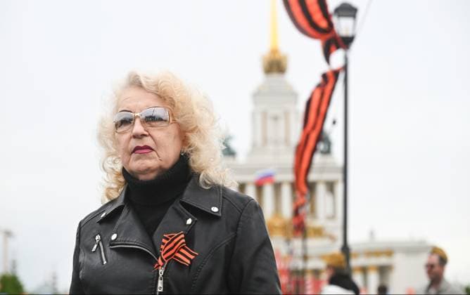 Russia WWII Victory Day Celebrations 9161584 09.05.2026 A woman takes part in the Victory Day celebrations, which marks the 81st anniversary of the victory over Nazi Germany in World War Two, in Moscow, Russia. Artem Kulekin Sputnik Moscow Russia  Copyright: xArtemxKulekinx