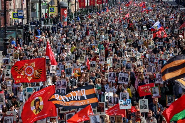 RUSSIA, ST PETERSBURG - MAY 9, 2026: People hold portraits of their relatives who fought in World War II as they take part in an Immortal Regiment event on Victory Day. Peter Kovalev TASS  92225135